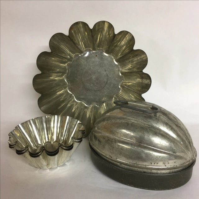 Antique/vintage/primitive pastry and pudding molds for farm and kitchen. Four fluted pastry forms marked made in France....
