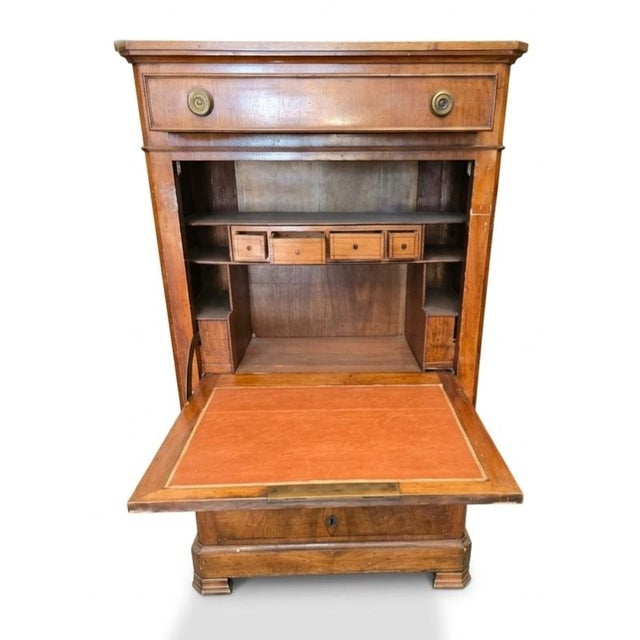 This Swiss Charles X Walnut Secretaire (also known as a secrétaire à abattant) dates to the 1850s and serves as a classic...