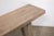 A beautifully rustic console table crafted from solid pinewood, dating to the first half of the 20th century. The long,...