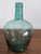 This medium sized, handmade green glass demijohn or carboy is signed Viresa on the spout. Made in the mid-century by...