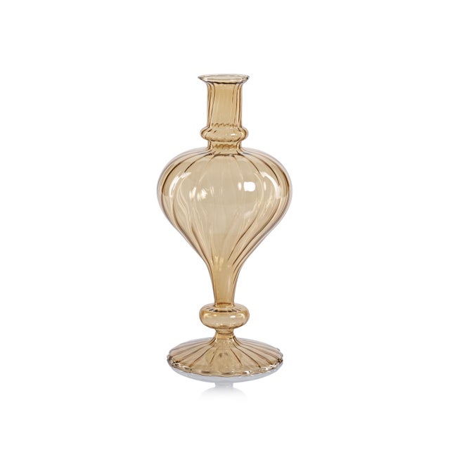 Made of glass, this set of 2 footed vases are a quaint touch to your home. Its exquisite craftsmanship and eye-catching...