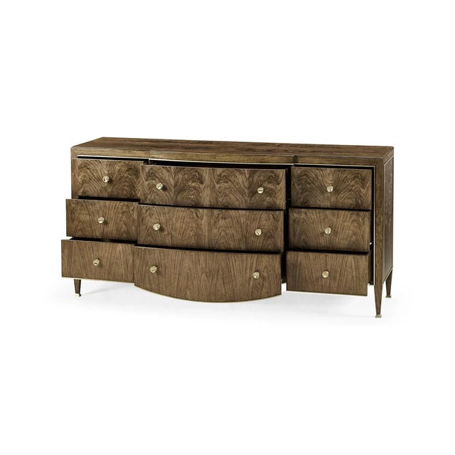 Modern French Walnut Dresser, with a transparent, low-luster finish. The nine-drawer fronts feature figured walnut in a...