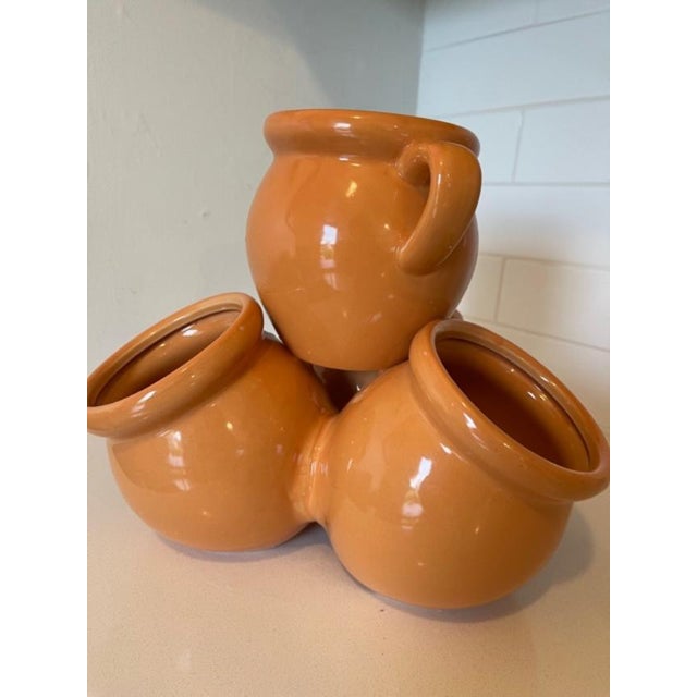 Unique, versatile and colorful ceramic piece with 4 vessels fused together to make a stunning one piece ceramic container...