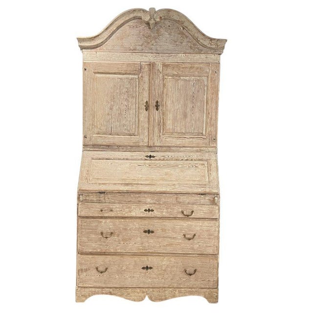 A stately Swedish tall case secrétaire with classic neoclassical proportions, featuring paneled doors, interior writing...