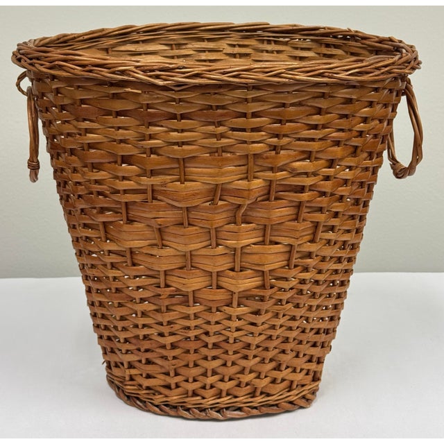 Vintage handwoven split reed and wicker tapered basket with dual side loop handles. Styled with a flared silhouette and...