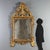 18th-century wall mirror from Piedmont, crafted in carved and gilded linden wood. The rectangular frame houses a mirror...
