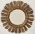 A beautiful French gilt sunburst (or starburst) mirror with gilded rays arranged around a mirror plate glass center....