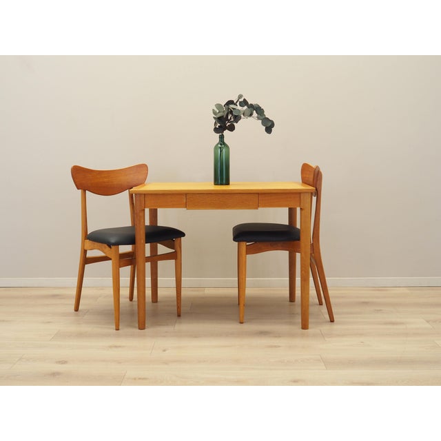 The desk was made in the 1970s, Danish production. The structure and tabletop are covered with ash veneer. The legs are...