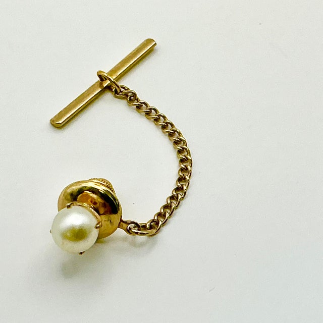 This is a classic Cultural Pearl Tie Clip/Tack from the 1970s. We have curated a collection of Mid-Century Cuff Links and...