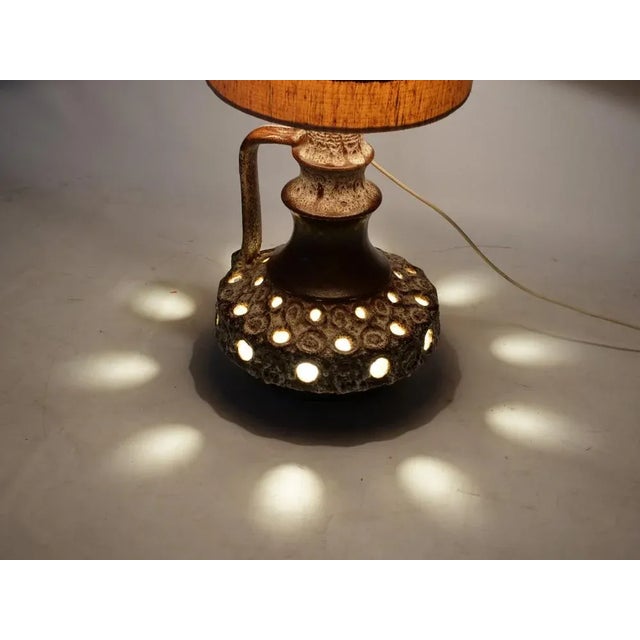 Double -illuminated floor lamp in the Fat Lava Design. The foot is made of ceramic the screen made of fabric. Height: 138...