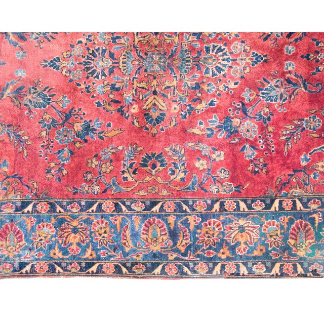 This early 20th-century Persian Kashan rug is a richly detailed example of one of Irans most celebrated weaving...