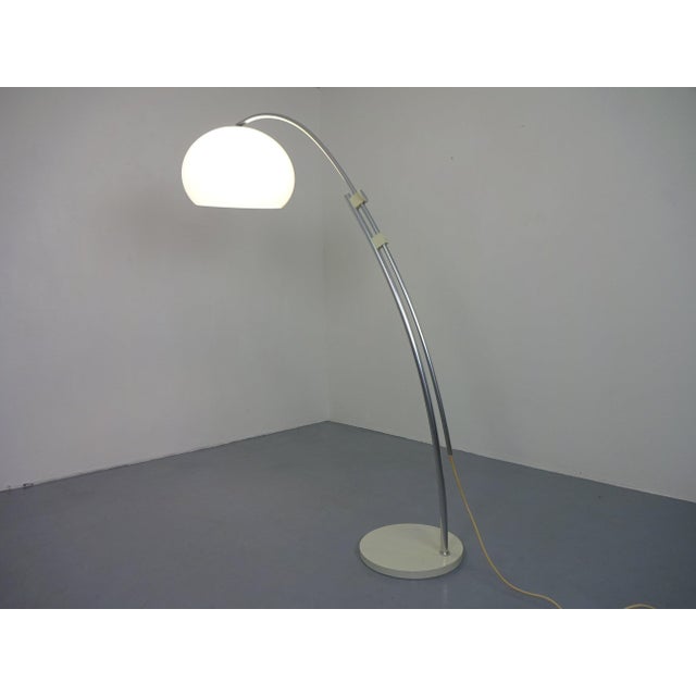 Large arc lamp from the 1970s, adjustable in height and angle. Height 140 - 196 cm. European Plug (up to 250V).The wiring...