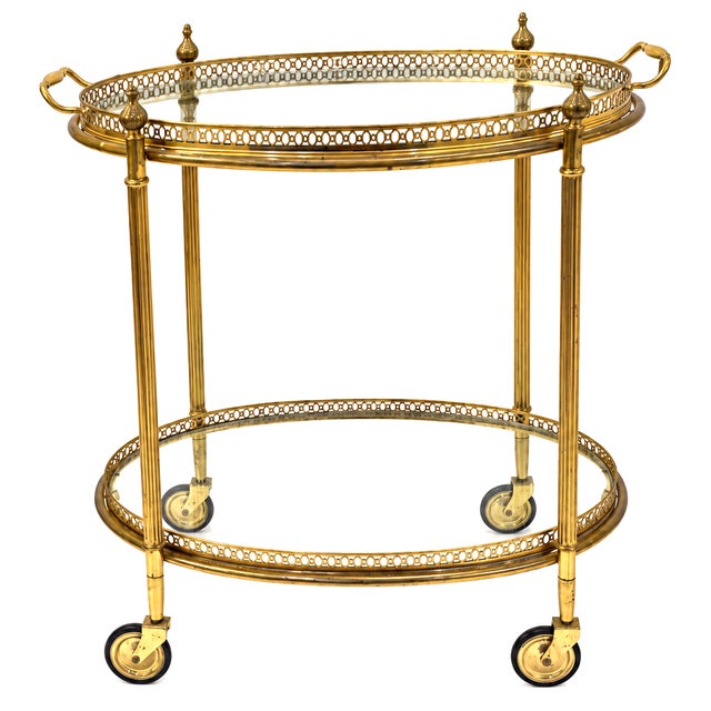 This is a stunning mid-century Maison Jansen attributed brass bar/dessert cart. Both trays are removable and the upper...