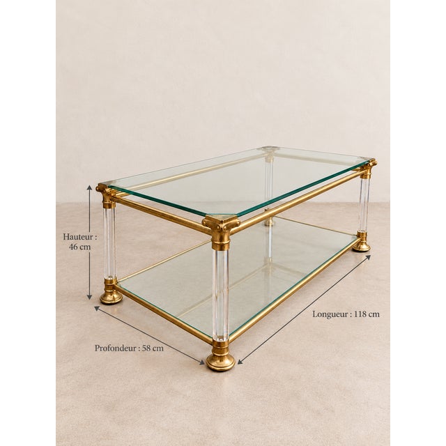 Elegant coffee table with retro charm Vintage 1970s. Glass and brass Dimensions: Height 46 cm, Width 118 cm, Depth 58 cm.