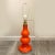 This French, 1960s, vintage case glass orange lamp has the original white painted foot. Its European plug is changed to a...