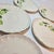 Ceramic Gold Rimmed Hops Saucers- Set of Eight For Sale - Image 7 of 10