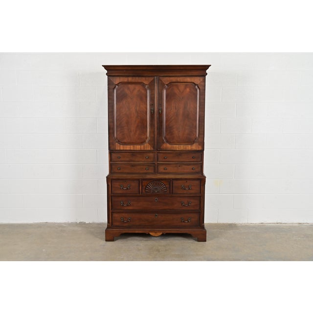 A gorgeous Georgian or Chippendale style armoire dresser, gentleman's chest, or linen press By Drexel Heritage, "Covington...