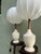 A matched pair of white ribbed ceramic urn-form table lamps, each on a hand-turned barley twist wooden stand, fitted with...