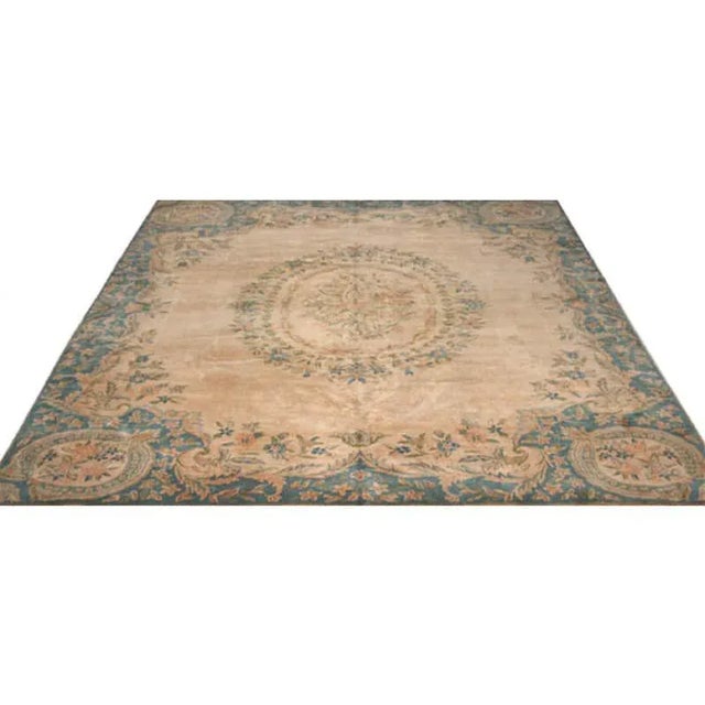 Traditional old handwoven Persian Kerman area rug featuring an intricately French-inspired floral motif on a lusciously...
