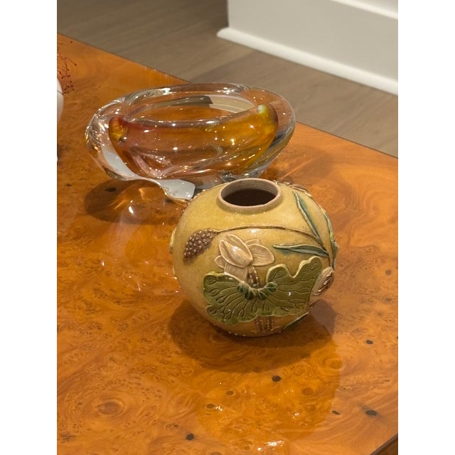 Charming petite scale mustard glazed pottery. The warm mustard ground is encircled by an exuberant pond scene of lotus...