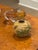 Charming petite scale mustard glazed pottery. The warm mustard ground is encircled by an exuberant pond scene of lotus...