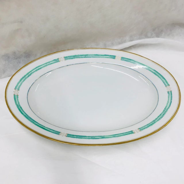 An aqua and gold design adorns the rim of this platter. This design would work well as a piece of any Mediterranean,...