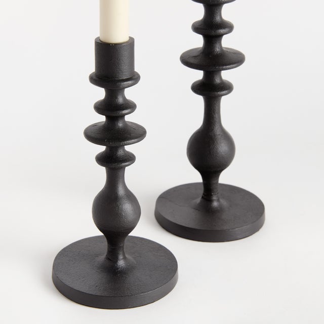 In a chunky, classic silhouette, the notches along the body of these candle stands add a modern touch. This set of two...