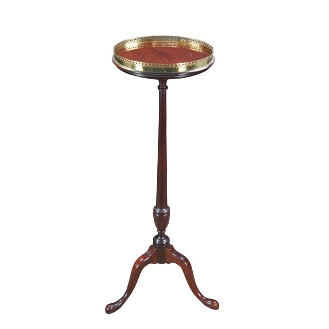 1980s Queen Anne style mahogany candlestand. Features a circular top with pierced brass gallery over a slender turned...