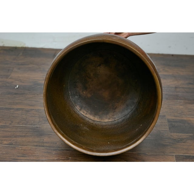 An English Arts & Crafts style copper planter. This remarkable English mid-century copper planter embodies the timeless...