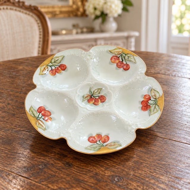 An elegant antique French porcelain oyster plate by Haviland & Co. of Limoges, circa 1900–1915. The sculptural plate...