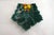 Mid-century earthenware dish with a star-shaped pattern of leaves and a braided center, decorated in relief with lemons...