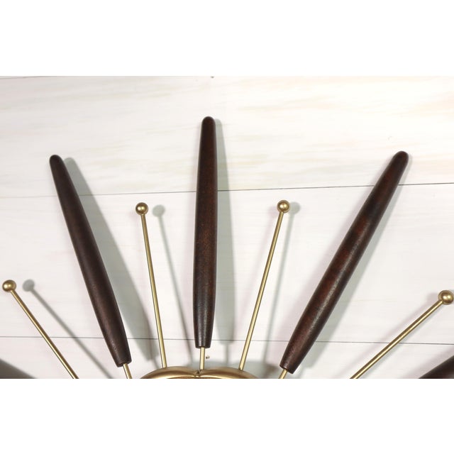 Mid century Starburst Wood Metal Wall Clock made by Lux/Robert Shaw in the 1960's or 1970's. It was orginally powered by a...