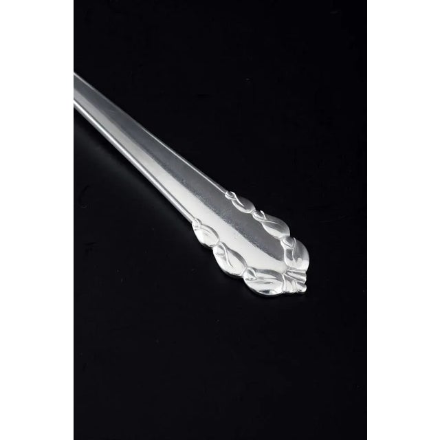Georg Jensen, Denmark Fish fork in the "Lily of the Valley" pattern. Polished sterling silver with an elegant handle...