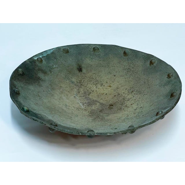 A beautiful bronze sculptural bowl heavily tarnished with an 18 inch diameter and 4 inches tall.