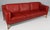 Børge Mogensen three-seat sofa with original red leather upholstery. Legs of oak. Model 2213, made by Fredericia...