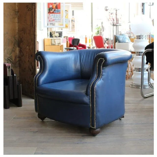 Blue armchair, Dated 1960s, Model Capitonné, Country of origin England, Materials Leather, Width 80 cm, Depth 75 cm,...