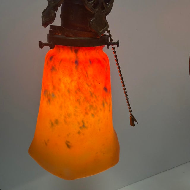 Offered is a striking antique Art Nouveau style two-light table lamp dating circa 1910–1930. This substantial early 20th...