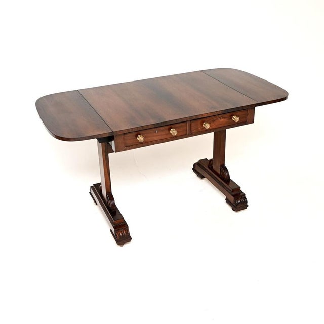 A stunning antique Regency period sofa table. This was made in England, it dates from around the 1810-1820 period. It is...
