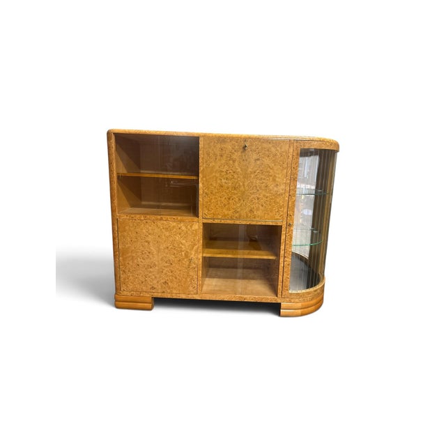 Original Art Deco Home Bar/Sideboard circa 1930 (No. 2646) Material: Poplar burl veneer, glass, mirror, brass Color:...