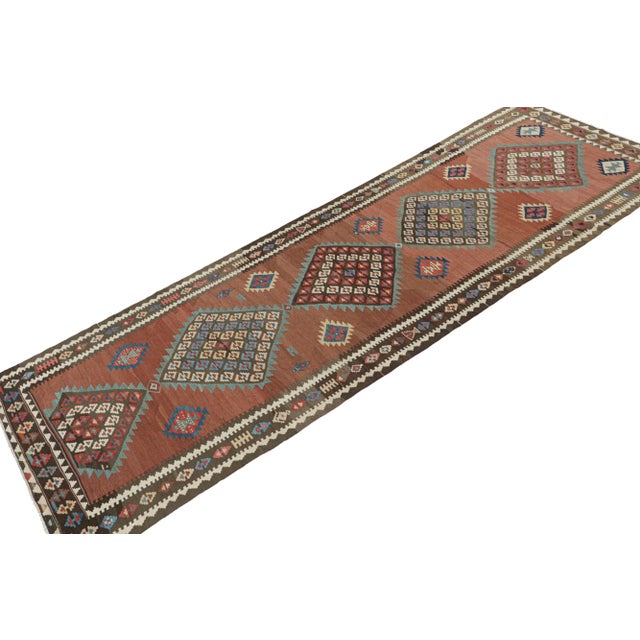 This vintage 5x14 Persian Kilim is a tribal gallery runner from Meshkin—a small northwestern village known for its...