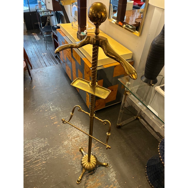 Solid Brass Valet From the 1970s Adjustable height for the trouser rack and the cufflink shelf. Measures 16 1/2w X 13″d 57...