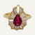 This is part of Chairish’s Fine Jewelry assortment. Lady’s ring with pear shaped ruby approximately 70 points surrounded...