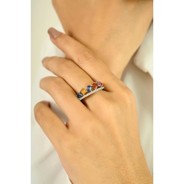 Add a burst of color and brilliance to your jewelry collection with this dazzling 14K white gold band ring. Featuring a...