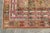 A gracefully aged antique prayer rug with a temple-like motif in the center. A beautiful rug that has maintained its charm...