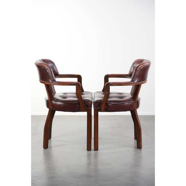 We are offering this set of 2 beautiful dark brown cowhide leather Chesterfield dining, side, and office chairs in the...