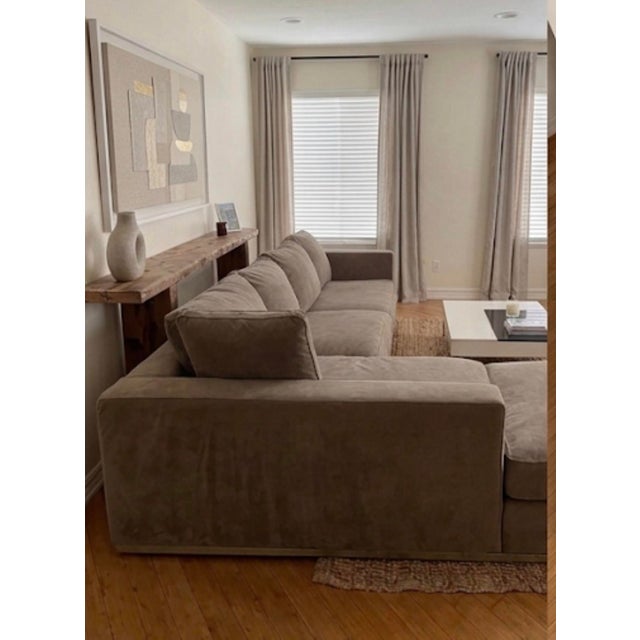 Elevate your living space with this exceptional Maxalto "Apta" Collection sectional sofa, designed by the legendary...