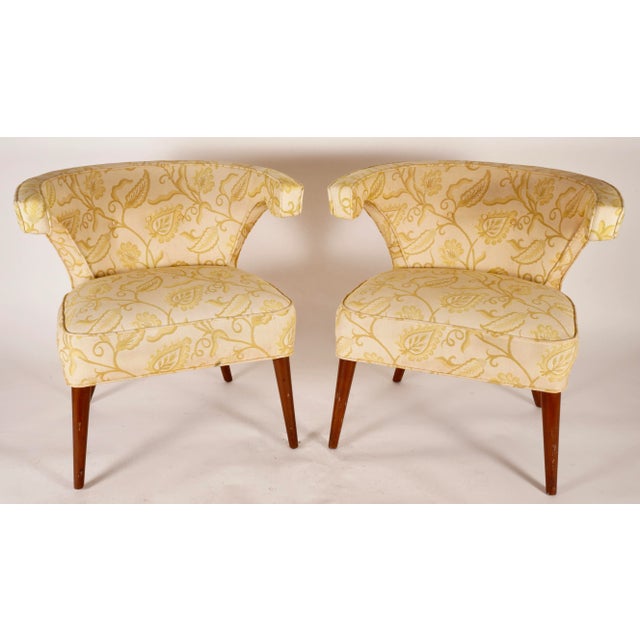 Wonderful pair of Veronese Klismos chairs by Tommi Parzinger . The curvaceous silhouette of these armchairs with their...