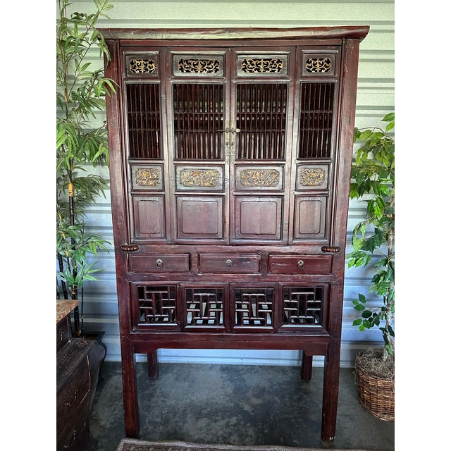 Antique Chinese lacquer kitchen cabinet. In excellent condition with all doors and drawers working well. Hand carving...