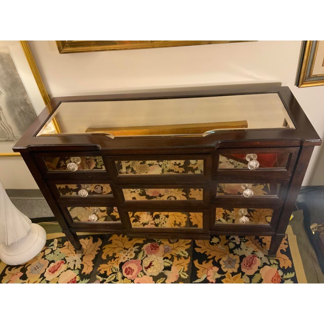 Bassett mirrored chest of drawers. Mirrored on top, front and sides. Three drawers. Pulls arcylic, back is unfinished.