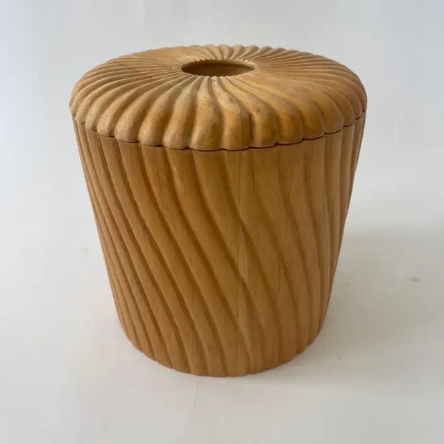 Sculptural organic Midcentury Modern ice bucket, rendered in hand carved spiral motif wood with a matched lid, inset...